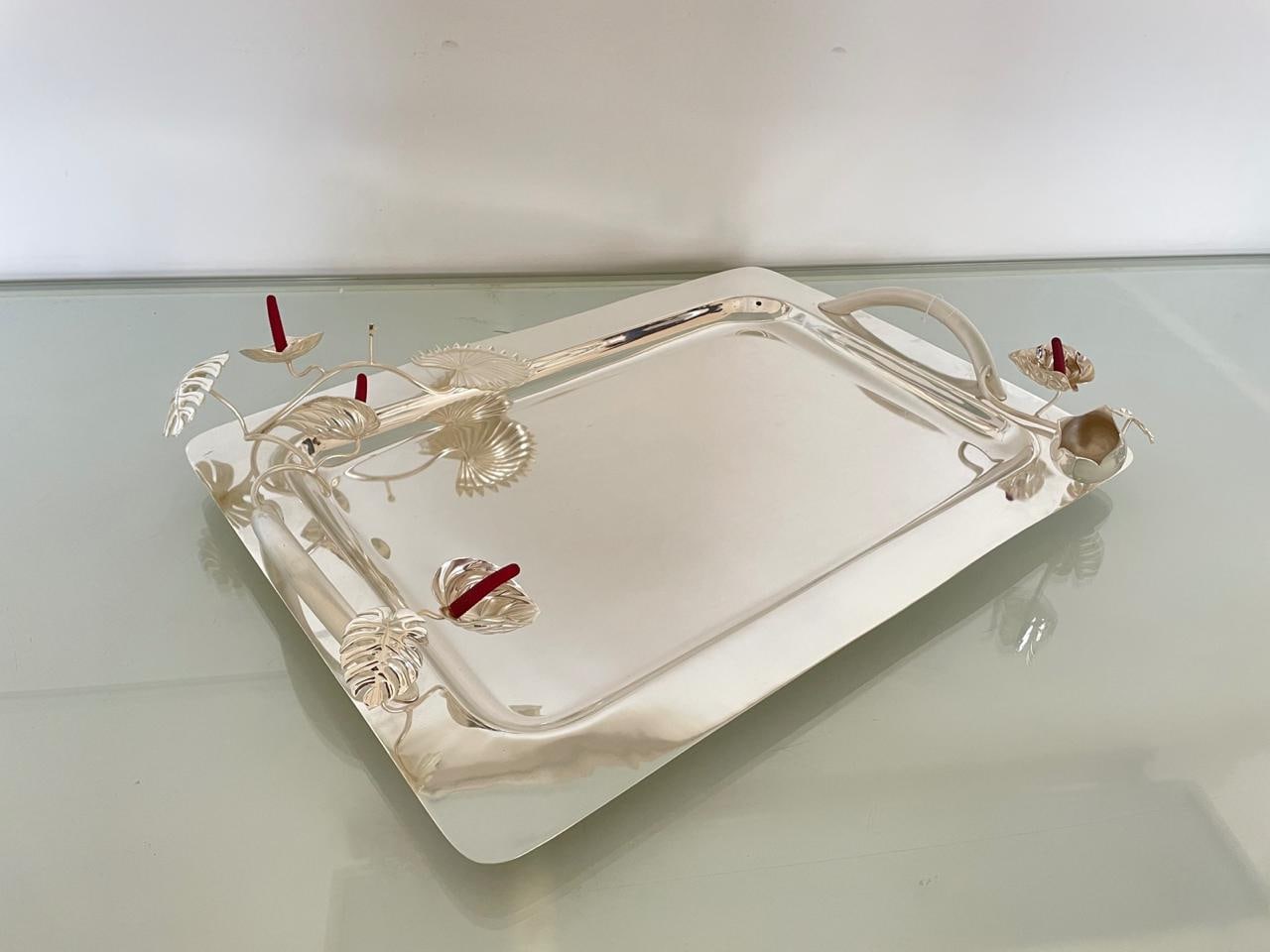 Rectangular polished silver serving tray with sculpted handles