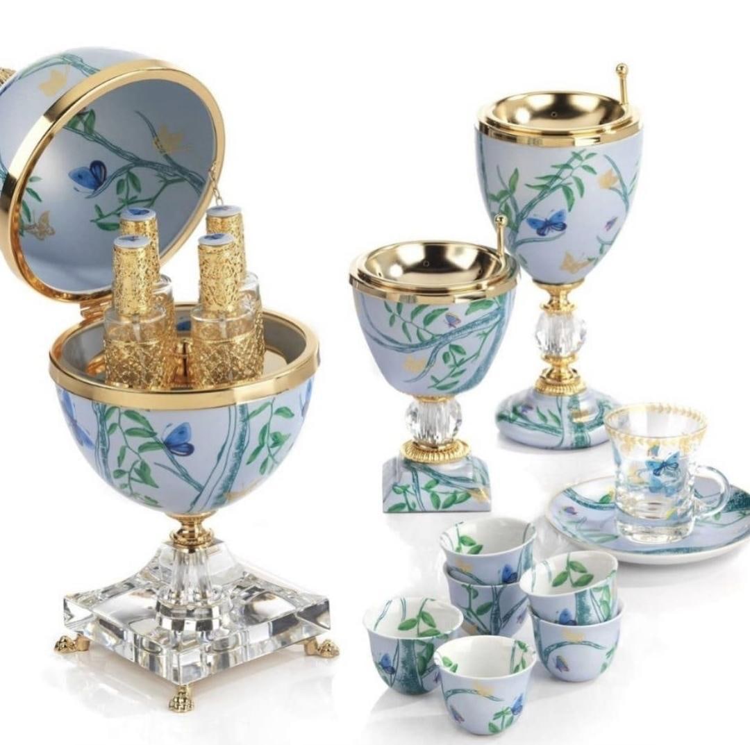 White porcelain egg casket, goblets and cups painted with blue flowers and gold fittings